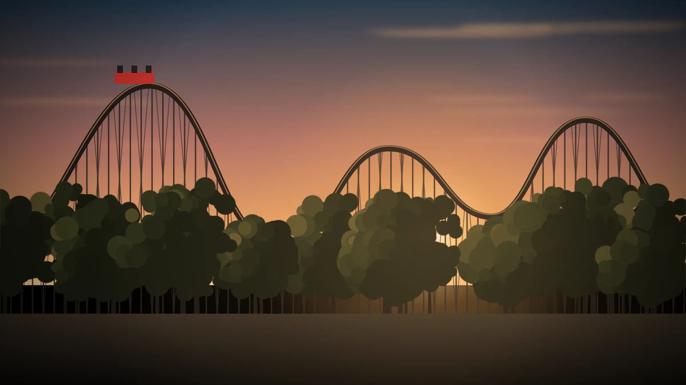 Montagnes russes d’un parc d’attractions au coucher du soleil